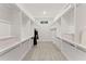 Spacious walk-in closet with custom shelving and carpeted floors at 001 Knob Creek Ct, Acworth, GA 30101