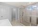 This bathroom offers a tiled shower with glass door and brushed nickel fixtures at 123 Academy Ln, Canton, GA 30114