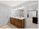 This is a bathroom with double sink vanity, a mirror and tiled floors at 123 Academy Ln, Canton, GA 30114