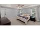 This light and airy main bedroom features a tray ceiling and neutral color palette at 123 Academy Ln, Canton, GA 30114