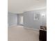 This bonus room features neutral walls, carpet, and a door to the outside at 123 Academy Ln, Canton, GA 30114