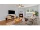 Inviting living room with a cozy fireplace, comfortable seating, and a large television at 123 Academy Ln, Canton, GA 30114