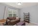 This is a bonus room featuring neutral walls, carpet, and a cozy seating area at 123 Academy Ln, Canton, GA 30114