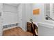 Functional mudroom with a built-in bench, storage, and a convenient desk area at 123 Academy Ln, Canton, GA 30114