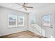 Bright bedroom with two windows and neutral walls, creating a cozy and inviting atmosphere for relaxation at 129 Kenney Way, Locust Grove, GA 30248