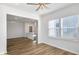 Bright dining area featuring hardwood floors, modern lighting, and access to an open-concept kitchen at 129 Kenney Way, Locust Grove, GA 30248
