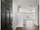 Inviting entryway featuring wood flooring that flows into the living area, creating a warm and seamless transition at 129 Kenney Way, Locust Grove, GA 30248