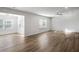 Expansive living area showcasing an open layout with multiple windows that let in plenty of natural light at 129 Kenney Way, Locust Grove, GA 30248