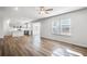 Spacious living room showcasing an open floor plan with a modern kitchen, enhancing the home's appeal at 129 Kenney Way, Locust Grove, GA 30248