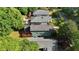 Birds eye shows the rear of the home with a wooden deck and screened in porch at 167 E Lake Se Ter, Atlanta, GA 30317