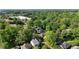 Aerial shot features lush foliage with homes nestled among the trees in residential area at 167 E Lake Se Ter, Atlanta, GA 30317