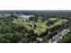 Aerial photograph showcasing lush greenery and neighborhood golf course, with a lake in the background at 167 E Lake Se Ter, Atlanta, GA 30317