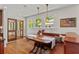 Breakfast nook with banquette seating, hanging lights, and view to the outdoors at 167 E Lake Se Ter, Atlanta, GA 30317