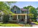 Charming two-story home with a welcoming front porch, stone accents and landscaped yard at 167 E Lake Se Ter, Atlanta, GA 30317