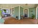 Cozy front porch with swing, seating and stained wood floors at 167 E Lake Se Ter, Atlanta, GA 30317