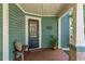 Leaded glass front door and entry way with stained wood flooring at 167 E Lake Se Ter, Atlanta, GA 30317