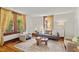 Cozy living room featuring hardwood floors and large windows, perfect for entertaining at 167 E Lake Se Ter, Atlanta, GA 30317