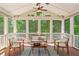 Relaxing screened porch with ample seating and views of the backyard at 167 E Lake Se Ter, Atlanta, GA 30317
