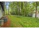 Lush backyard featuring wooded surroundings and lovely lawn at 2700 Brook Park Way, Doraville, GA 30340
