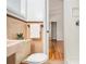 Bathroom with pink sink, matching tile, and view to bedroom at 2700 Brook Park Way, Doraville, GA 30340