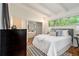 Bright bedroom with hardwood floors, neutral decor, and large windows at 2700 Brook Park Way, Doraville, GA 30340