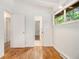 Bright, open bedroom with hardwood floors and multiple doorways at 2700 Brook Park Way, Doraville, GA 30340
