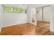 Bedroom with hardwood floors, natural light, and large mirror closet at 2700 Brook Park Way, Doraville, GA 30340