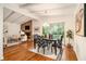 Dining area open to living room; brick fireplace, wood floors, natural light at 2700 Brook Park Way, Doraville, GA 30340