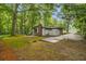 Exterior side view of home showing yard, patio, and shed at 2700 Brook Park Way, Doraville, GA 30340