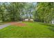 Charming home featuring a lush green lawn, mature trees, and inviting curb appeal at 2700 Brook Park Way, Doraville, GA 30340