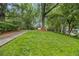 Lovely lawn and driveway leading up to the home, enhanced by mature trees at 2700 Brook Park Way, Doraville, GA 30340