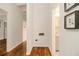 Hallway with hardwood floors leading to the laundry and other rooms at 2700 Brook Park Way, Doraville, GA 30340