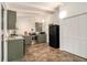 Bright kitchen with stainless steel appliances, gray cabinetry, and storage at 2700 Brook Park Way, Doraville, GA 30340