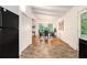 View from kitchen shows the dining area; natural light, white walls, wood floors at 2700 Brook Park Way, Doraville, GA 30340