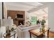 Bright living room boasts a brick fireplace, wood floors, and neutral decor at 2700 Brook Park Way, Doraville, GA 30340