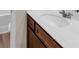 Bathroom with a white marble counter and dark wood cabinets at 436 Vermeer Ct, Locust Grove, GA 30248