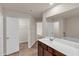 A bright, spacious bathroom with double access to a walk in closet at 436 Vermeer Ct, Locust Grove, GA 30248