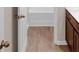 Bathroom view shows vanity cabinet and bathtub at 436 Vermeer Ct, Locust Grove, GA 30248