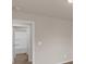 Bedroom with bathroom entrance and neutral carpet at 436 Vermeer Ct, Locust Grove, GA 30248