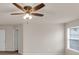 A large bedroom is equipped with a ceiling fan and natural lighting at 436 Vermeer Ct, Locust Grove, GA 30248