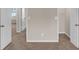Neutral bedroom with a plush carpet, closet, and doors, providing a tranquil space at 436 Vermeer Ct, Locust Grove, GA 30248