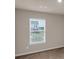 Bedroom with natural light streams through the window, highlighting the room's cozy ambiance at 436 Vermeer Ct, Locust Grove, GA 30248
