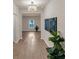 Inviting entryway featuring modern decor, wood floors, a stylish chandelier, and an open floor plan at 436 Vermeer Ct, Locust Grove, GA 30248
