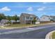 Beautiful home showcasing its desirable location on a corner lot with scenic views and lush greenery at 436 Vermeer Ct, Locust Grove, GA 30248