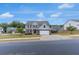 Charming two-story home with a well-manicured lawn, enhancing its curb appeal in a friendly neighborhood at 436 Vermeer Ct, Locust Grove, GA 30248