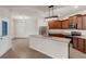 Open kitchen with wood cabinets, stainless steel appliances, and a granite-topped island at 436 Vermeer Ct, Locust Grove, GA 30248