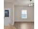 Bright dining area with a modern chandelier and view of the entry door at 436 Vermeer Ct, Locust Grove, GA 30248