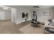 Open-concept living room with modern decor, neutral walls, wood floors, and ample natural light at 436 Vermeer Ct, Locust Grove, GA 30248