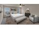 The main bedroom offers modern decor with plentiful windows and ample space at 436 Vermeer Ct, Locust Grove, GA 30248