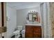 Functional bathroom features a vanity with mirror and a shower with patterned curtain at 5083 Lambeth Nw Ct, Acworth, GA 30101